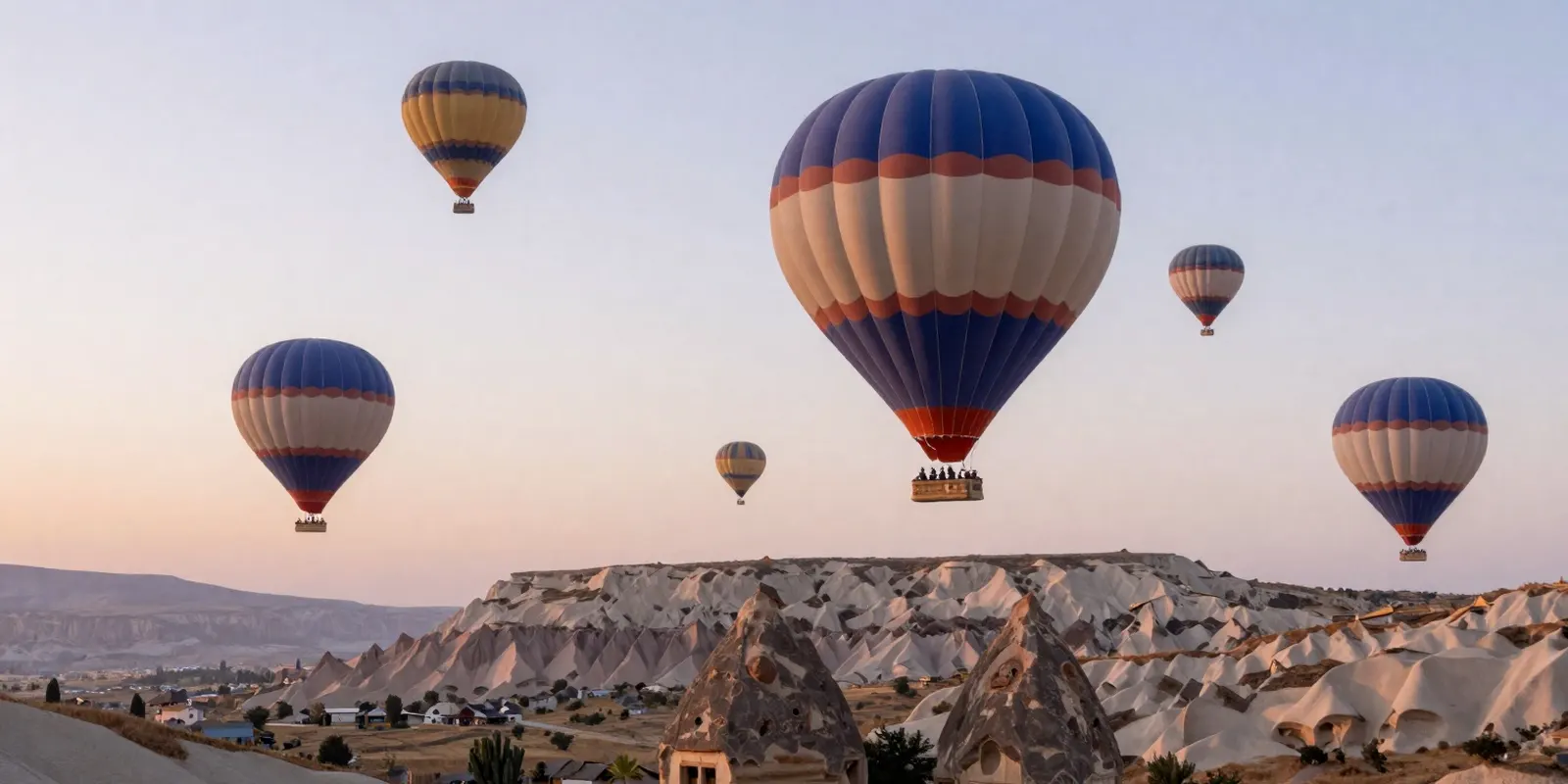 Hot air balloons over the rock formations of Cappadocia at sunrise